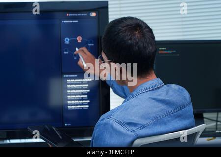 Programmer Developing Artificial Intelligence Software Stock Photo