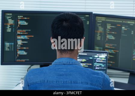 Programmer focused on software development, coding, artificial intelligence, and digital technology for modern cyberspace applications. Stock Photo