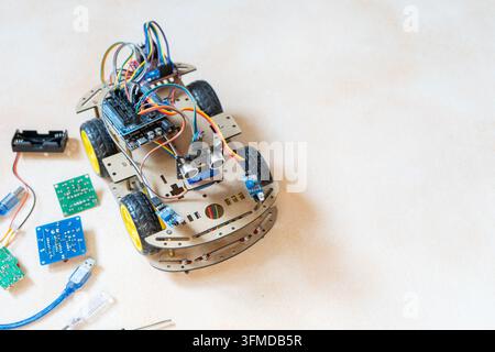 DIY Robot Car Assembly and Components. Educational electronics project for STEM learning and robotics copy space. Stock Photo