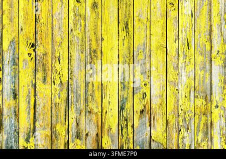 Yellow old wood texture background, weathered wooden wall with peeling yellow paint Stock Photo