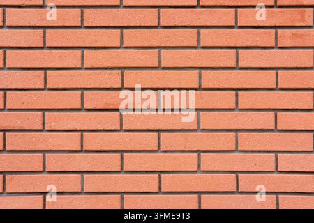 Background from a wall of clean orange bricks Stock Photo