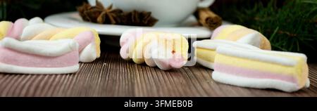Christmas New Year Close-Up Background with Pastel Marshmallows and Fir Branches on Wooden Table, Festive Holiday DecorChristmas New Year Close-Up Bac Stock Photo