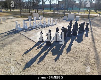 Giant outdoor chess set installed in the public park of Parco Te in Mantua, Italy during a sunny winter day. Stock Photo