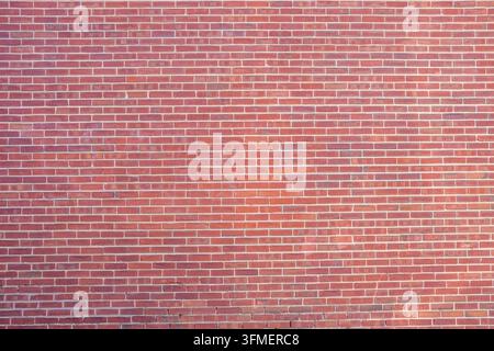 Background from a large wall of red bricks Stock Photo