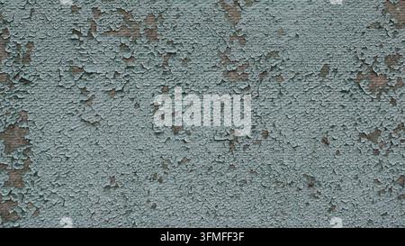A background of old, cracked enamel with a pronounced aged effect. The textured surface is speckled with numerous tiny flakes and chips in a pale Stock Photo