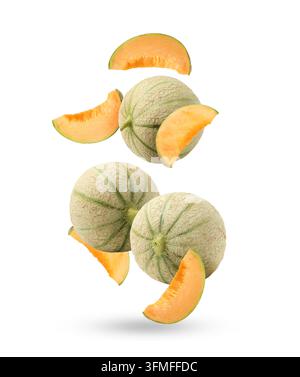 Fresh cantaloupe melons falling on white background. Whole and sliced Stock Photo