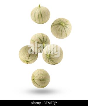 Fresh cantaloupe melons falling on white background Stock Photo