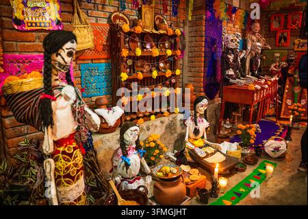 Handcrafted papier-mâché skulls, are displayed for sale to customers ...