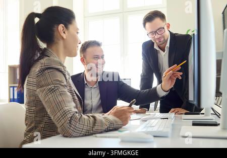 Business team meeting at office computer for strategy planning and analysis Stock Photo