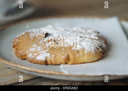 Large cookie placed on a paper towel, ready to be served in a cafe Stock Photo
