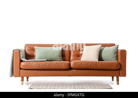 Interior design and home comfort, brown leather sofa with decorative pillows and throw blanket isolated on a clean white background for furniture cata Stock Photo