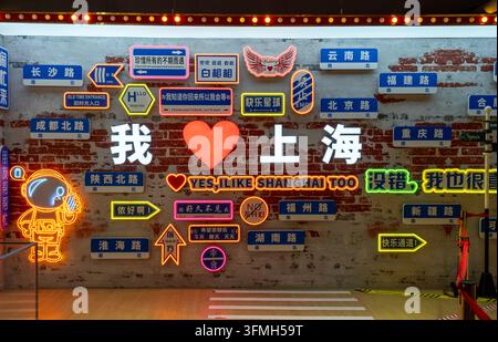 Shanghai, China - May 11, 2025 a popular neon photo wall in Shanghai, featuring road signs of famous streets like Nanjing Road and Yunnan Road arrange Stock Photo