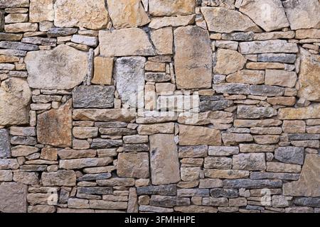 Old rustic stone wall texture background Stock Photo