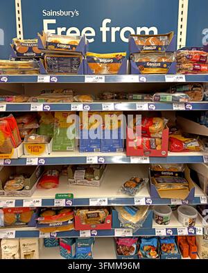 Supermarket Free From aisle displaying specialist foods for allergy, intolerance and restricted diets. Stock Photo