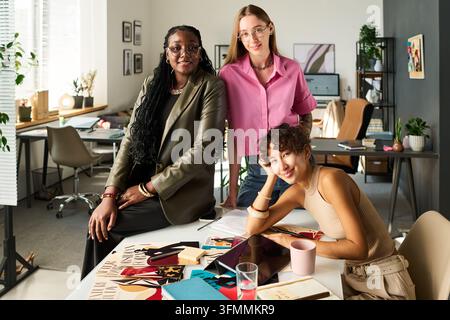 Portrait of Diverse Creative Women Brand Designers Working in Studio Stock Photo