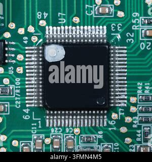 Macro of small microprocessor soldered printed circuit board Stock Photo