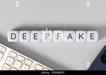 deepfake text on white cubes. flat lay Stock Photo