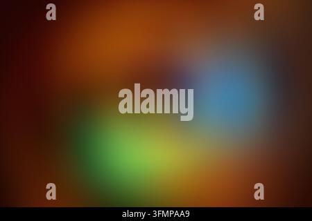 Abstract radial vortex background featuring softly blurred blue, green, yellow, and orange circles. Defocused color and gentle glow create a dreamy di Stock Photo