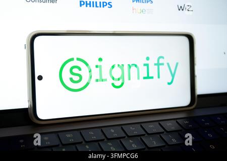 Mexico city, mexico, 06 20 2026, smartphone screen showing signify logo with philips, hue, and wiz logos in background Stock Photo