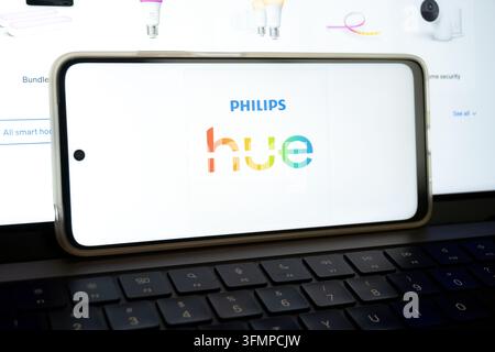 Mexico city, mexico, 06 20 2026, smartphone showing philips hue logo resting on a laptop keyboard Stock Photo