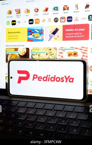 Mexico city, mexico, 06 20 2026, pedidosya logo on smartphone with food delivery app visible on laptop Stock Photo