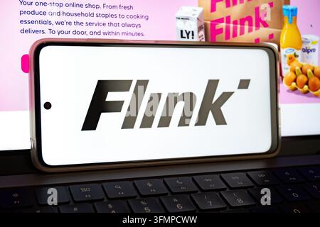 Mexico city, mexico, 06 20 2026, smartphone displaying the flink mobile app logo on a laptop keyboard Stock Photo