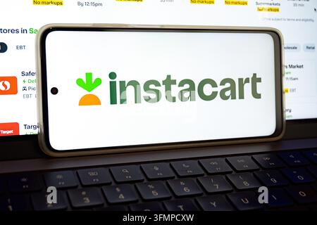 Mexico city, mexico, 06 20 2026, instacart logo displayed on a smartphone screen over a laptop keyboard Stock Photo