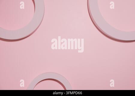 Abstract pink geometric composition with overlapping circular forms and soft shadows on a pastel background, minimalist modern design backdrop Stock Photo