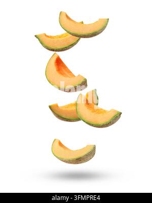 Pieces of cantaloupe melon falling on white background Stock Photo