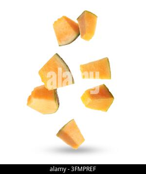 Pieces of cantaloupe melon falling on white background Stock Photo