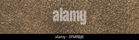 Macro panoramic photograph of a dark brown suede leather surface displaying a fine velvety texture and subtle golden sheen under soft diffuse lighting Stock Photo