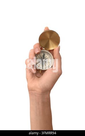 Direction and guidance concept, woman holding a vintage brass compass for navigation and travel planning isolated on a clean white background Stock Photo