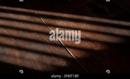 Soft Diagonal Shadows On Dark Wood Background Surface Stock Photo