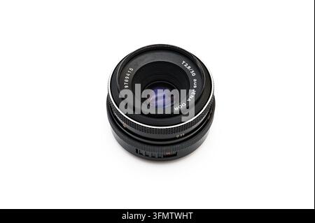 Iserlohn, Germany - September 20, 2026: Vintage aus Jena DDR T 2.8 50mm manual camera lens isolated on white background. Stock Photo