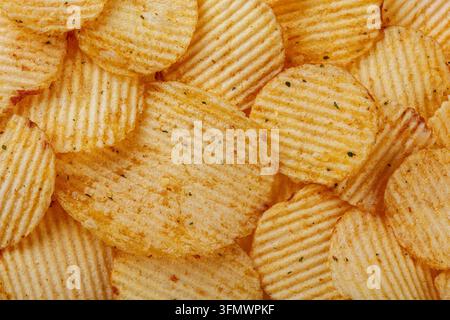 Lots of potato chips, texture close up Stock Photo