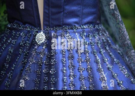 Close-up of a luxurious blue evening dress embroidered with beads and sequins Stock Photo