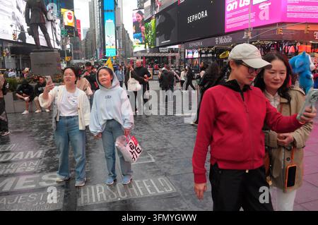 People are seen in Times Square, Manhattan. (Photo by Jimin Kim / SOPA ...