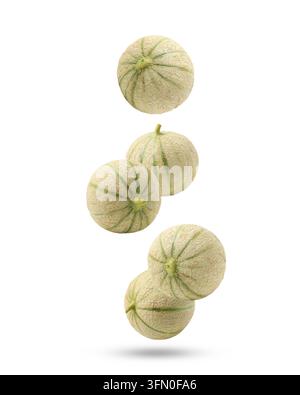 Fresh cantaloupe melons falling on white background Stock Photo