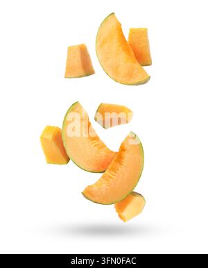 Pieces of cantaloupe melon falling on white background Stock Photo