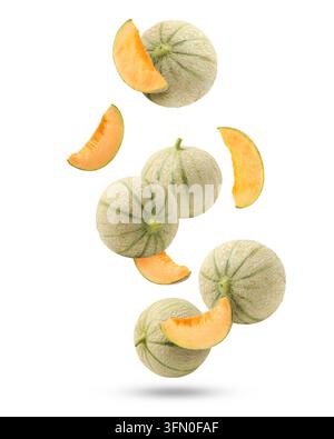 Fresh cantaloupe melons falling on white background. Whole and sliced Stock Photo