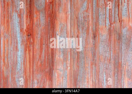 Red Orange Paint Dripping on Corrugated Metal Sheet – Grunge Industrial Texture Background Stock Photo