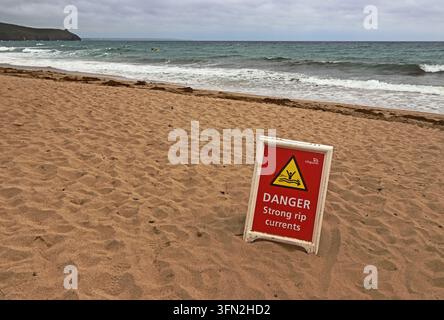 Red, Danger, Strong rip currents sign on beach at Praa Sands, Cornwall Stock Photo