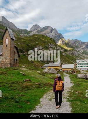 Hiker explores the stunning Meglisalp region in Appenzell, Switzerland. Stock Photo