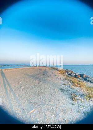 View of a beautiful blue gradient skyline in Corfu, Greece. Picture from a private beach on a short hillside in the mild heat, relaxing evening view. Stock Photo