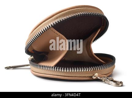 open empty beige leather coin purse isolated white background, round small wallet with metal zipper and dark interior in close-up side view Stock Photo