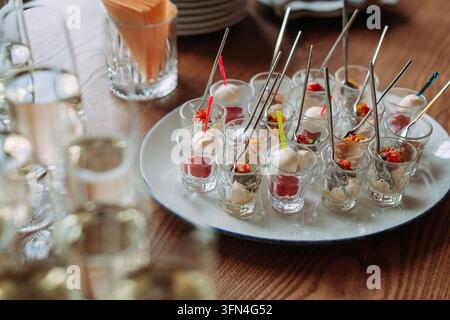 Assorted mini desserts served in glasses for a party Stock Photo