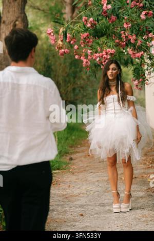 Groom Seen From Behind Facing The Bride Stock Photo
