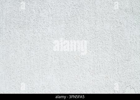 Closeup surface detail of white plaster concrete wall texture background. Bright empty space and rough finishing for backdrop design decoration in arc Stock Photo