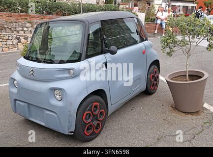 Tiny Citroën Ami electric quadricycle parked on a street in Taormina, Sicily, Italy. Stock Photo