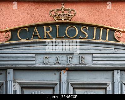 Door of the historic Cafe del Coliseo, founded by King Carlos III in the 18th century, located in San Lorenzo de El Escorial, Madrid, Spain. Stock Photo